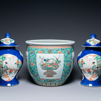 A pair of Chinese famille verte powder blue-ground vases and a fish bowl, 19th C.