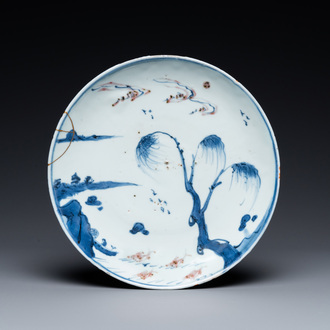 A Chinese blue, white and copper red ko-sometsuke 'fish' plate for the Japanese market, Transitional period