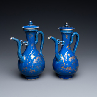 A pair of Chinese gilt-decorated powder blue-ground 'qilin' ewers and covers, Kangxi