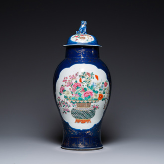 A Chinese blue-ground famille rose vase and cover, Kangxi mark, 19th C.