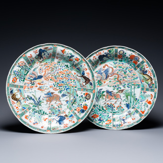 A pair of Chinese famille verte 'mythical animals' dishes, seal marks, Kangxi