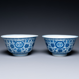 A pair of Chinese blue and white 'wan shou wu jiang' bowls, Qianlong mark and of the period