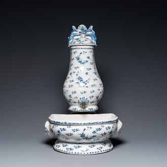 A blue and white Brussels faience fountain with basin, 18th C.