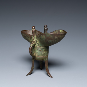 A Chinese bronze ritual wine vessel or 'jue', inscribed and dated 1701, Kangxi