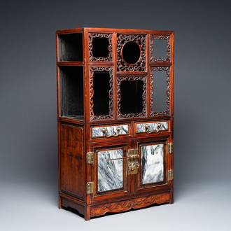 A small Chinese open-worked carved wooden cabinet with marble insets, 19th C.