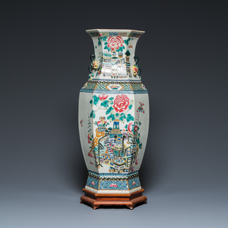 A hexagonal Chinese famille rose vase with antiquities and peacocks, 19th C.