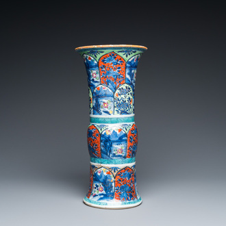 A Chinese blue and white 'gu' vase with European clobbered design, Kangxi