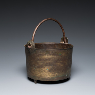 A bronze tripod kettle with handle, probably France, 17th C.