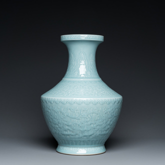 A Chinese monochrome claire-de-lune-glazed 'lotus scroll' vase, 'hu', Qianlong mark but probably later