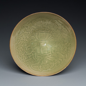 A Chinese Yaozhou celadon bowl with underglaze floral design, probably Song