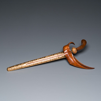 An Indonesian 'kris' or 'keris' dagger in polished Javanese wood with gilt copper and precious stones, 19th C.