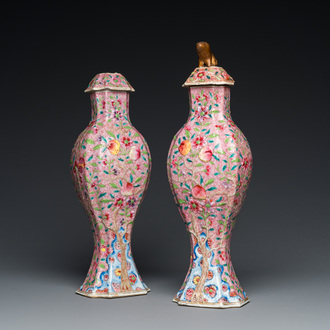 A pair of Chinese famille rose vases and covers, Yongzheng