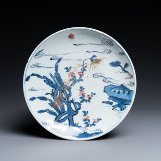 A Chinese blue, white and copper-red ko-sometsuke 'pagoda' plate for the Japanese market, Transitional period