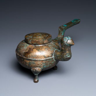 A Chinese gilt bronze tripod 'he' kettle with bird head-shaped spout, Han