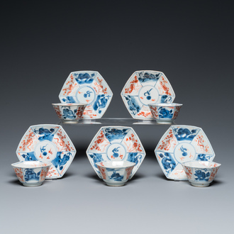 Five octagonal Chinese blue, white and iron-red cups and saucers, Kangxi