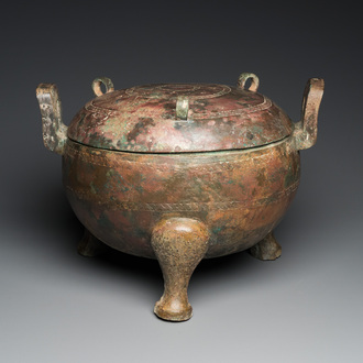 A very large archaic bronze tripod vessel and cover, 'ding', Eastern Zhou period