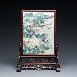 A Chinese famille rose plaque mounted as a table screen, Qianlong