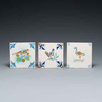 Three polychrome Delft tiles with a chicken, a crested tit and an ostrich, 17th C.