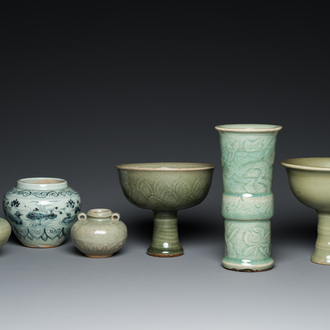 Three Chinese celadon-glazed vases, two stem cups and a blue and white vase, Ming