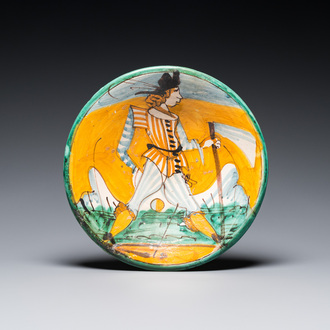 A polychrome Italian maiolica dish with a soldier, Montelupo, 17th C.