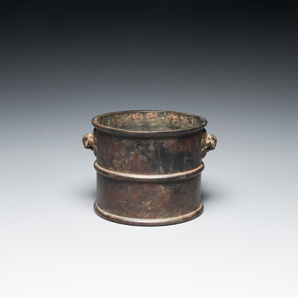 A Chinese bronze censer with mythical beast head handles, Xuande mark, Kangxi