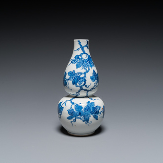 A Chinese blue and white double gourd vase, 19th C.