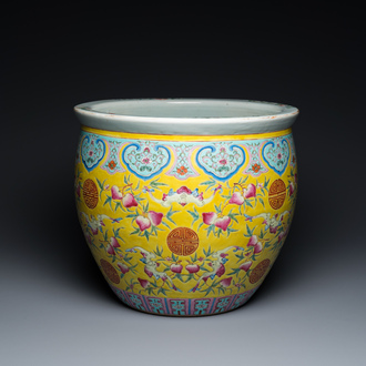 A Chinese famille rose yellow-ground fish bowl with bats and peaches, 19th C.