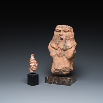 Een Romeinse terracotta sculptuur van de god Bes en een grotesk mannenhoofdje, ca. 1e eeuw