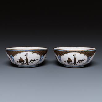 A pair of Chinese Canton enamel 'antiquities' bowls, Yongzheng/Qianlong