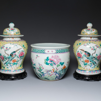 A pair of Chinese famille rose covered vases and a jardinière, 19/20th C.