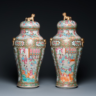 A pair of Chinese Canton famille rose vases and covers, 19th C.