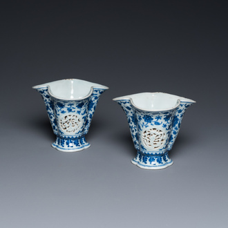 A pair of Chinese reticulated and double-walled blue and white Ming-style beakers with lotus scrolls, Qianlong