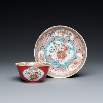 A Chinese famille rose ruby-ground cup and saucer, Yongzheng