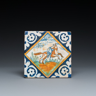 A polychrome Dutch maiolica tile with a fox and his prey, ca. 1600
