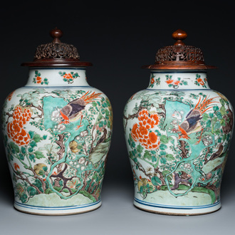 A pair of Chinese famille verte 'pheasant' vases with wooden covers, Kangxi