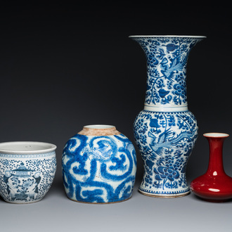 Three Chinese blue and white vases and a monochrome red vase, 19th C.