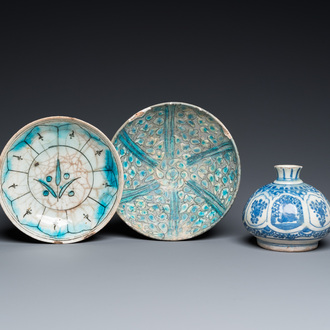 A blue and white Safavid hookah base, a Kashan bowl and a Kutahya plate, Persia and Turkey, 14th C. and later