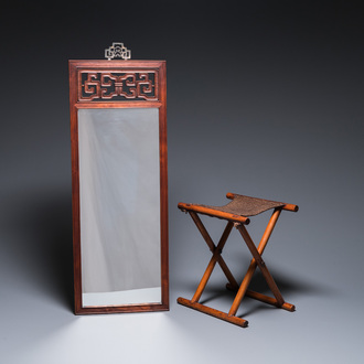 A Chinese wooden mirror and a foldable stool, 19/20th C.