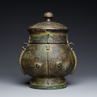 An extremely rare and important Chinese archaic bronze ritual wine vessel and cover, 'You' 卣, Shang dynasty, Yinxu period