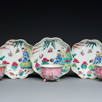 Three Chinese relief-decorated famille rose 'lotus' cups and saucers with a scholar and his servant, Yongzheng