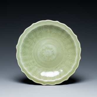 A Chinese Longquan celadon lotus-form dish with underglaze floral design, Ming