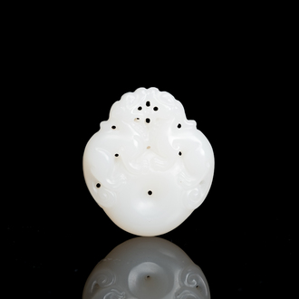 A Chinese white jade 'mythical beasts' pendant, Qing