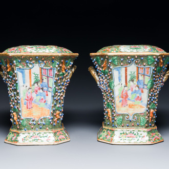 A pair of Chinese Canton famille rose flower holders and covers, 19th C.