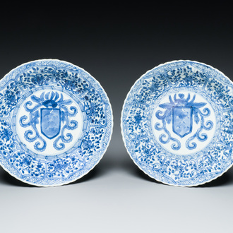 A pair of Chinese blue and white plates with the arms of the De Pinto family for the Portuguese market, Kangxi