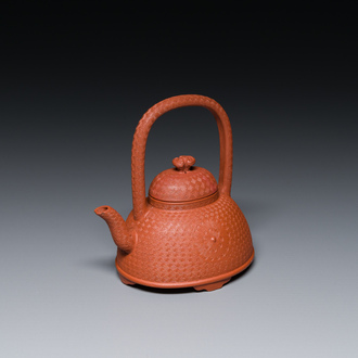 A Chinese Yixing stoneware carved 'chrysanthemum' teapot and cover, Kangxi