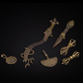 A varied collection of Tibetan bronze, iron and copper alloy ritual instruments, 14th C. and later