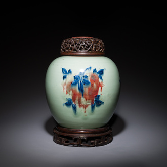 A Chinese celadon-ground blue, white and copper-red ginger jar with reticulated wooden cover and stand, 18th C.