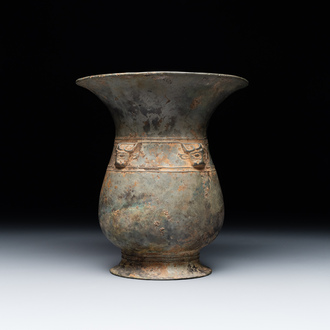 A Chinese archaic bronze ritual wine vessel with buffalo heads, 'zhi 觯', Western Zhou