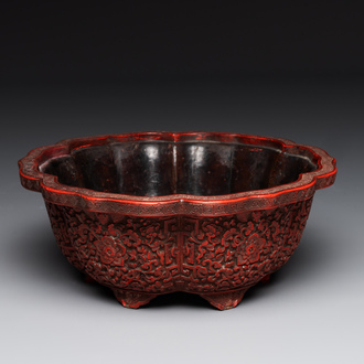 A Chinese red cinnabar lacquer jardiniere with floral design, Yongzheng/Qianlong