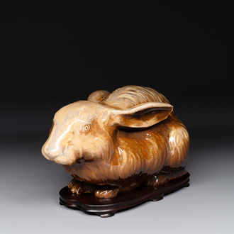 A fine Chinese cafe-au-lait glazed hare on wooden stand, Tian 天 mark, Qing